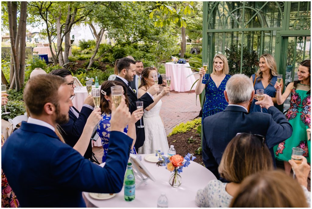 Guests listening to speech at Denver Botanic Gardens during reception