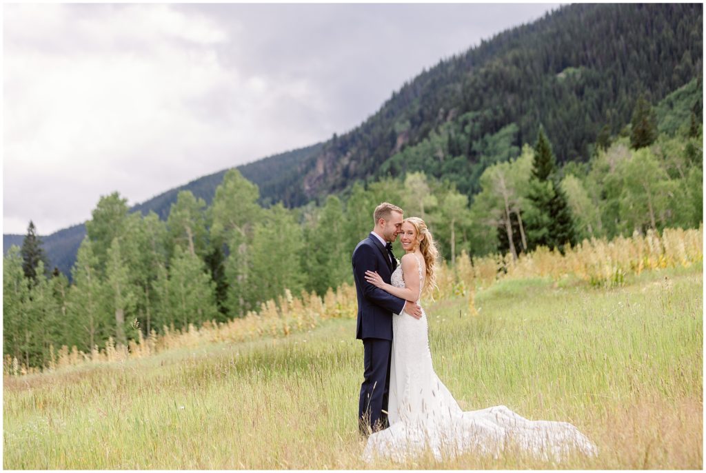 Bride and groom outside beans cabin before wedding