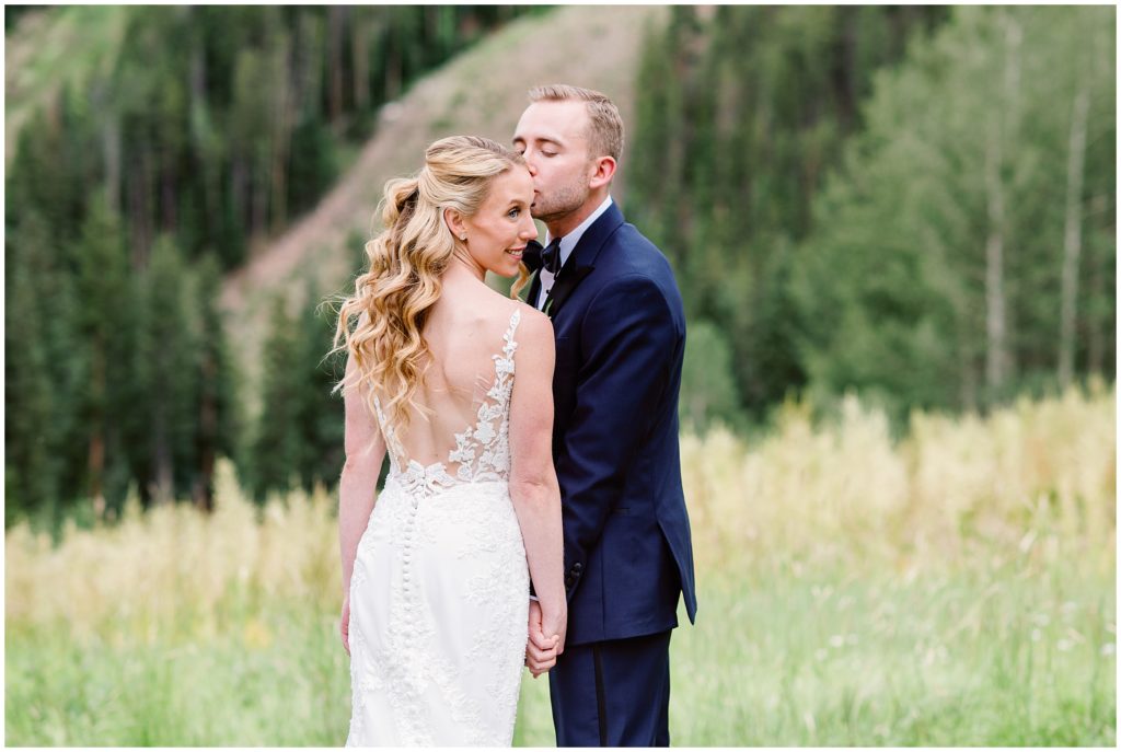 Bride and groom outside beans cabin before wedding