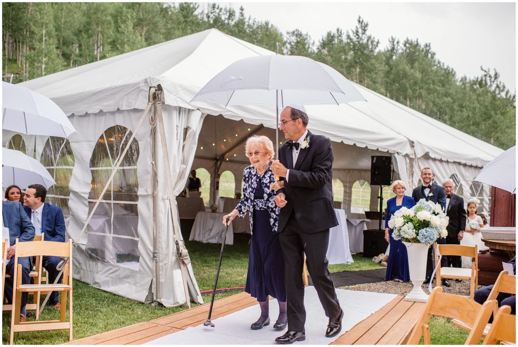 Grandparents walking down the aisle before wedding