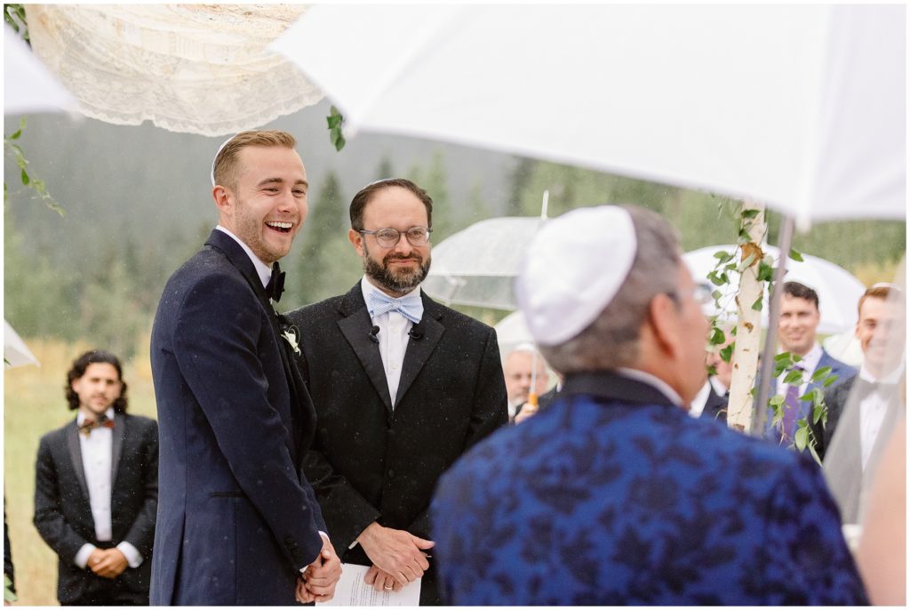 Groom seeing bride walking down the aisle before wedding