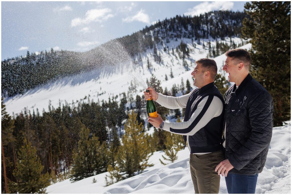 Popping champagne during an LGBTQ proposal at Sapphire Point