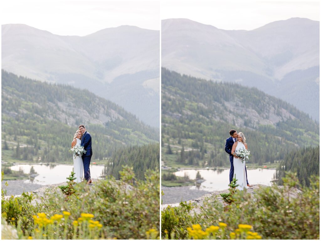 Bride and groom standing on hill overlooking Blue Lake in Breckenridge