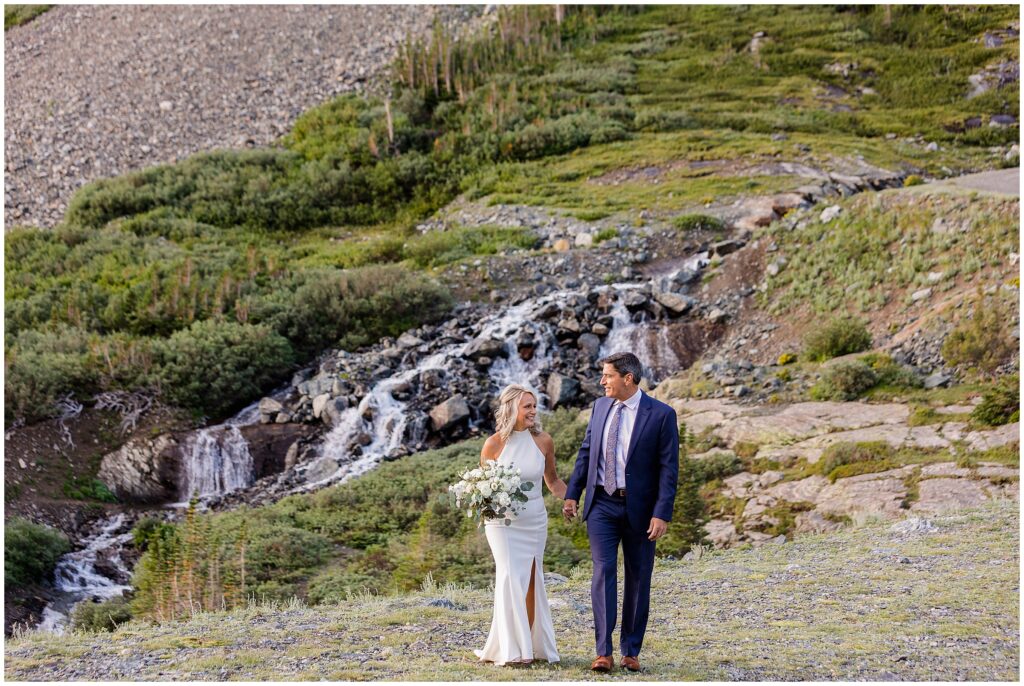 Bride and groom walking at Blue Lake in Breckenridge