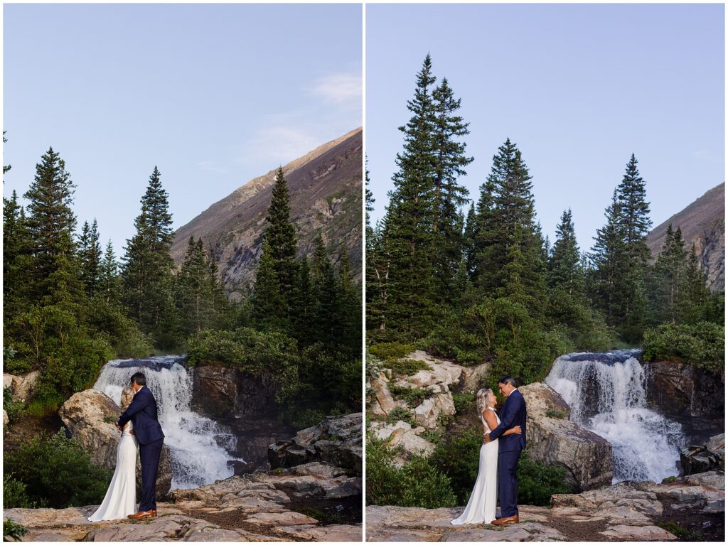 Bride and groom by water fall at Blue Lake in Breckenridge
