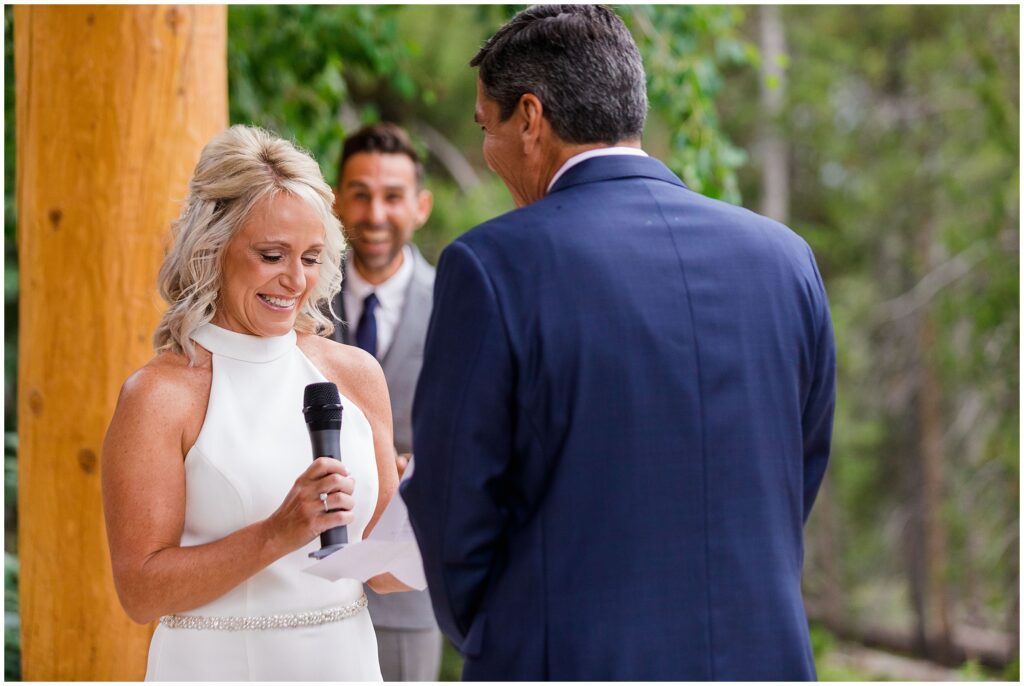 Bride reading vows during ceremony at Rubywood House
