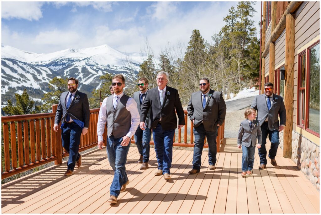 Groomsmen walking out on deck after getting dressed