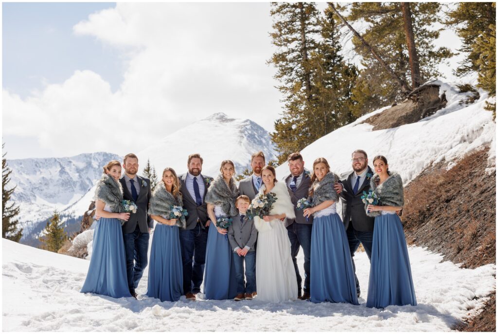 Bridal party outside on snow before ceremony