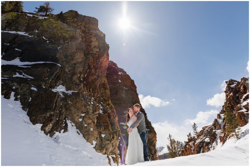 Bride and groom out in a Rocky Mountain field