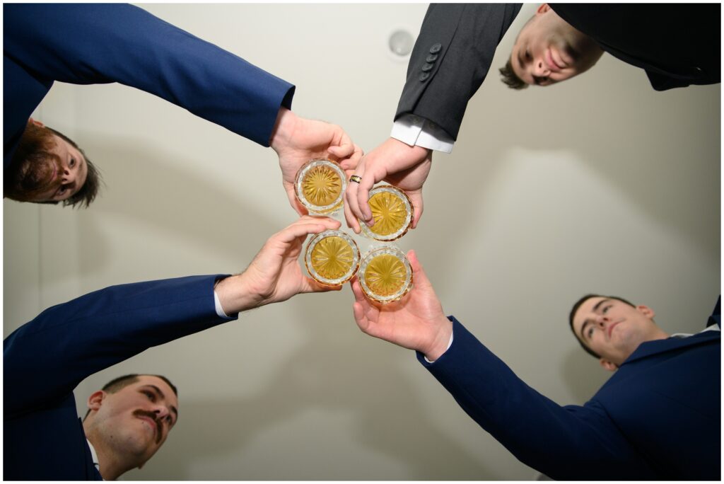 Groomsmen toasting after getting ready