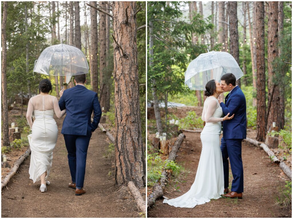 Bride and groom walking down trail in rain and holding umbrella