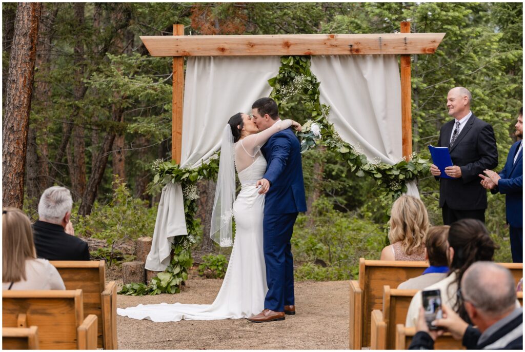 Bride and groom kiss at end of ceremony