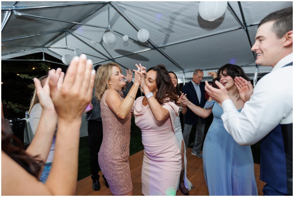 Open dancing with guests at wedding reception