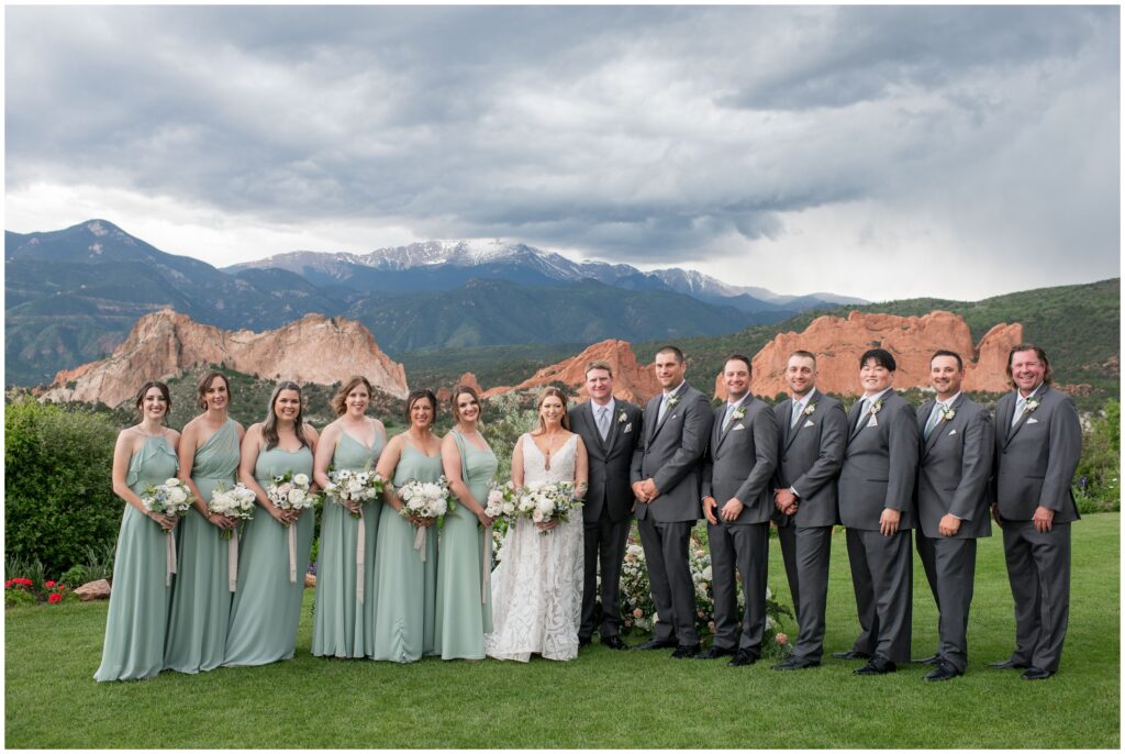 Bridal party with mountains in background at Garden of the Gods Resort