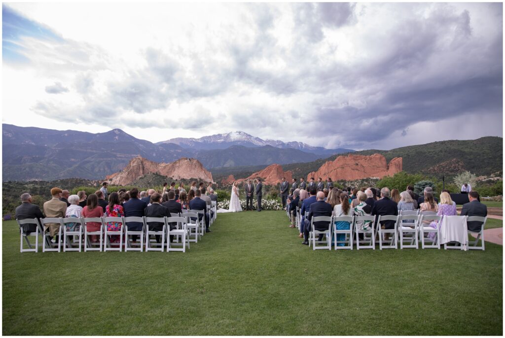 Guests seated viewing bride and groom at Garden of the Gods Resort