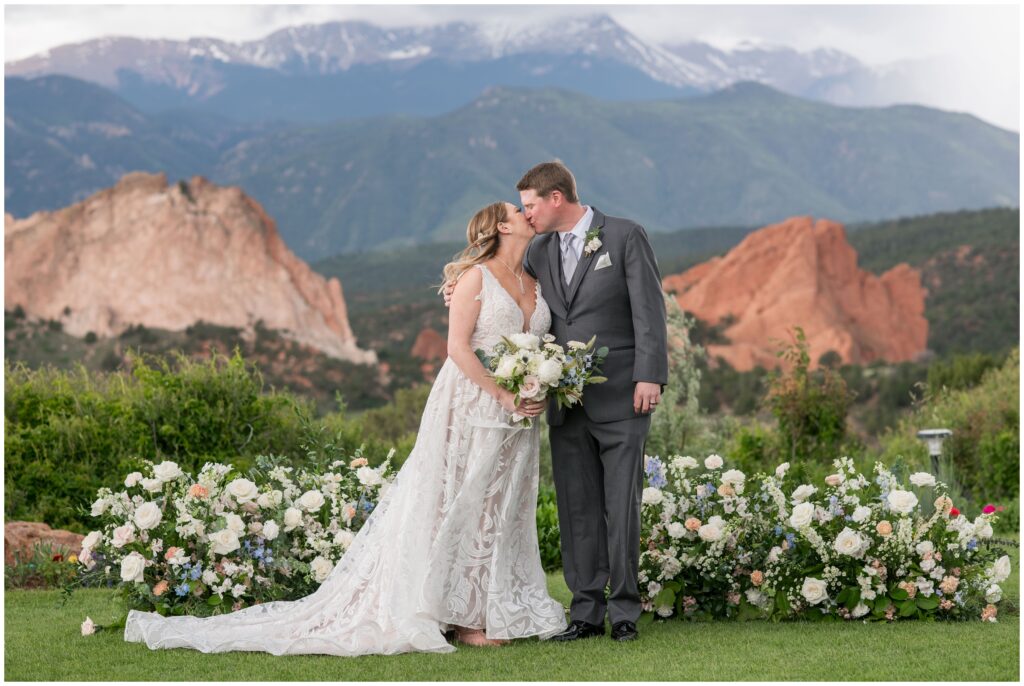 Bride and groom kiss after ceremony at Garden of the Gods Resort