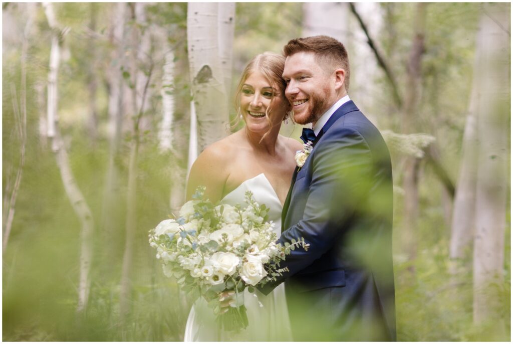 Bride and groom in Aspen tree meadow