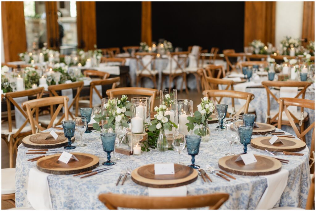 Reception table at Donovan Pavilion designed by Bustle and Bloom floral decor and BBJ La Tavola linens and dinnerware by Colorado Party Rentals
