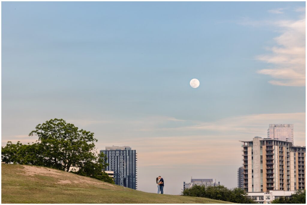 Moon over couple during Austin engagement session