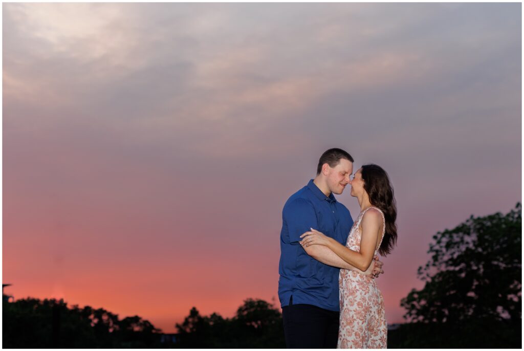 Couple hugging at night during Austin engagement session