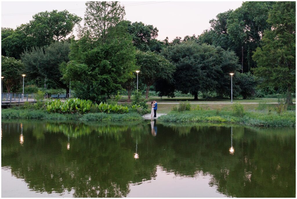 Couple during evening in front of lake during Austin engagement session