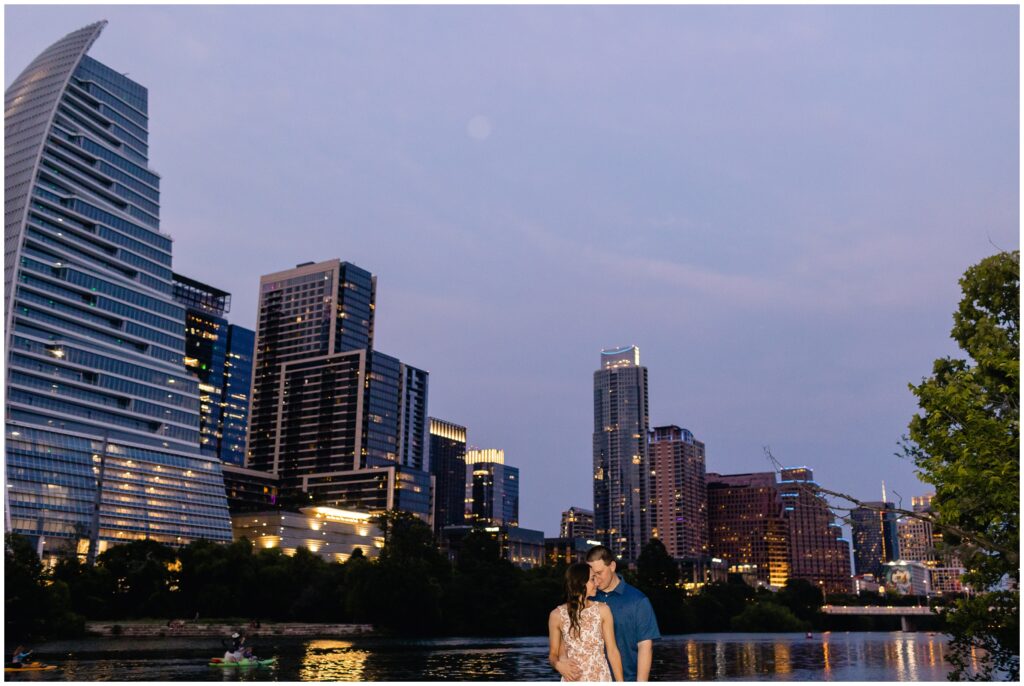 Couple hugging downtown Austin during engagement session