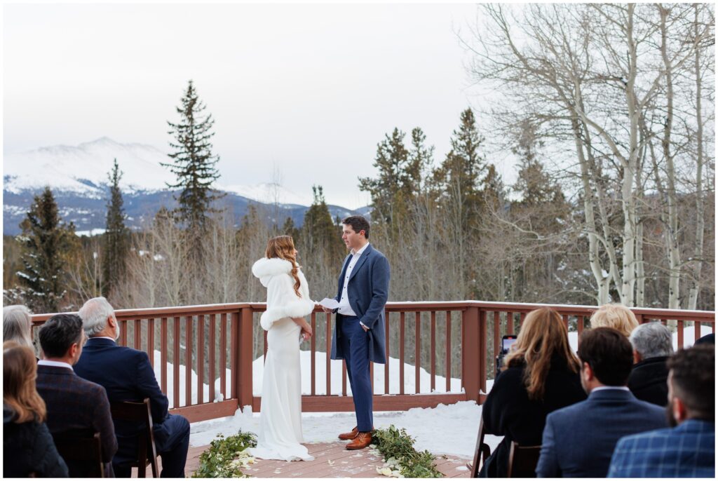 groom reading vows at High Country Lodge Breckenridge