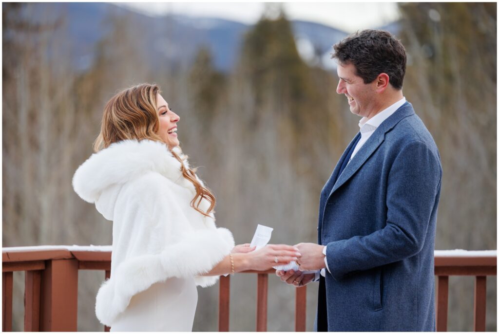 bride and groom smiling during ceremony at High Country Lodge Breckenridge