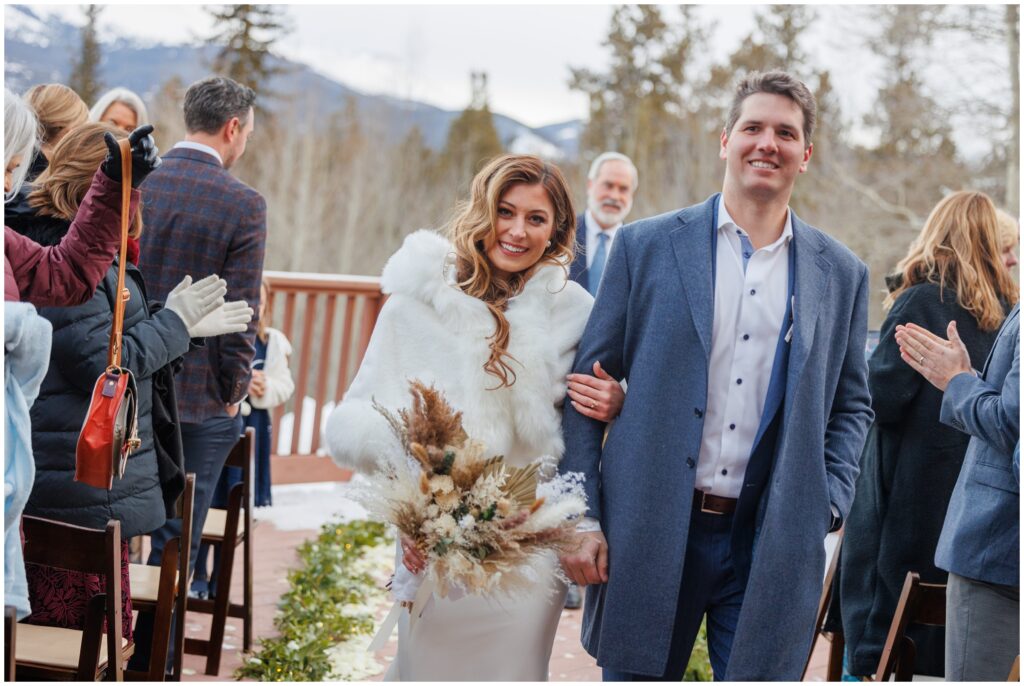 bride and groom walking down isle after ceremony at High Country Lodge Breckenridge