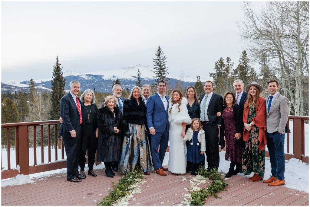 family and friends with bride and groom on patio at High Country Lodge Breckenridge