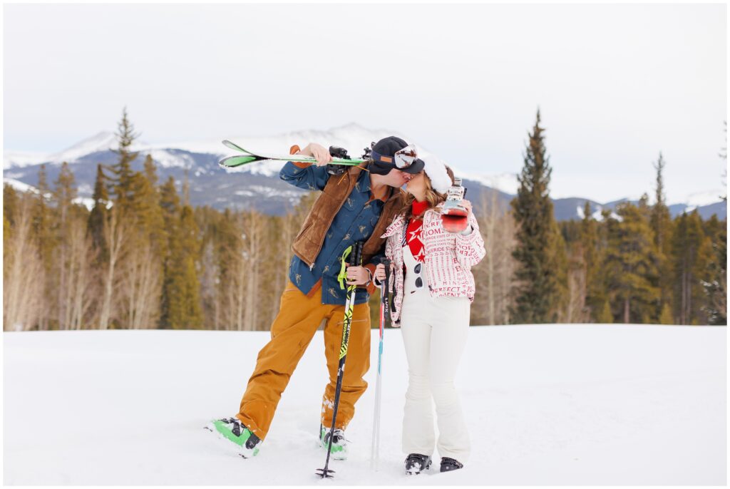 bride and groom kiss wearing retro skiing clothes on Breckenridge