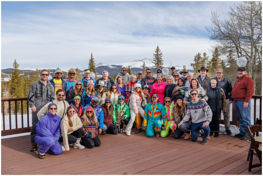 bride and groom with family and friends wearing retro clothes during skiing 