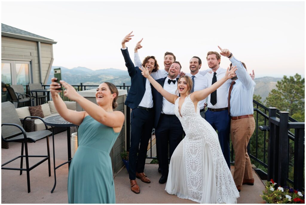 Bridesmaid taking selfie with bridal party and bride at Mt Vernon