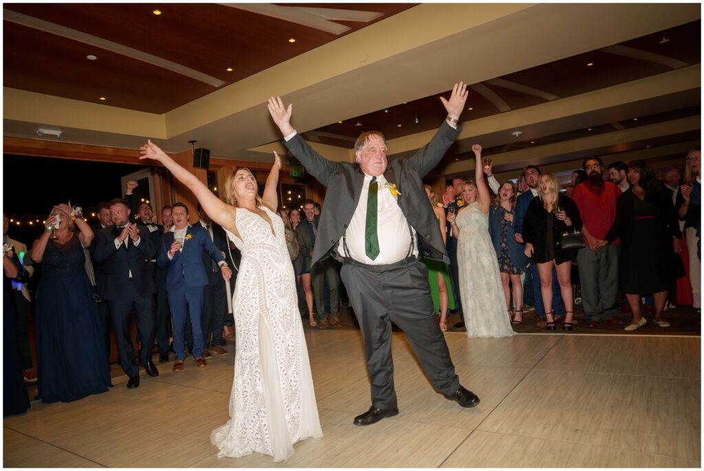 Father daughter dance and raising arms up