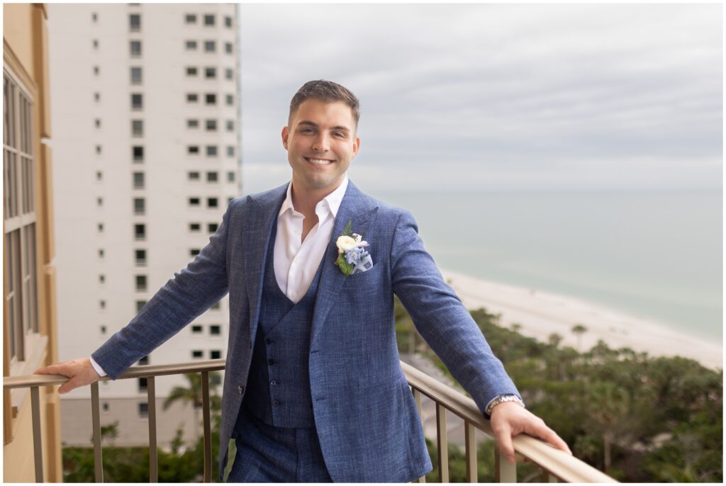 Groom on balcony at Ritz Carlton in Naples