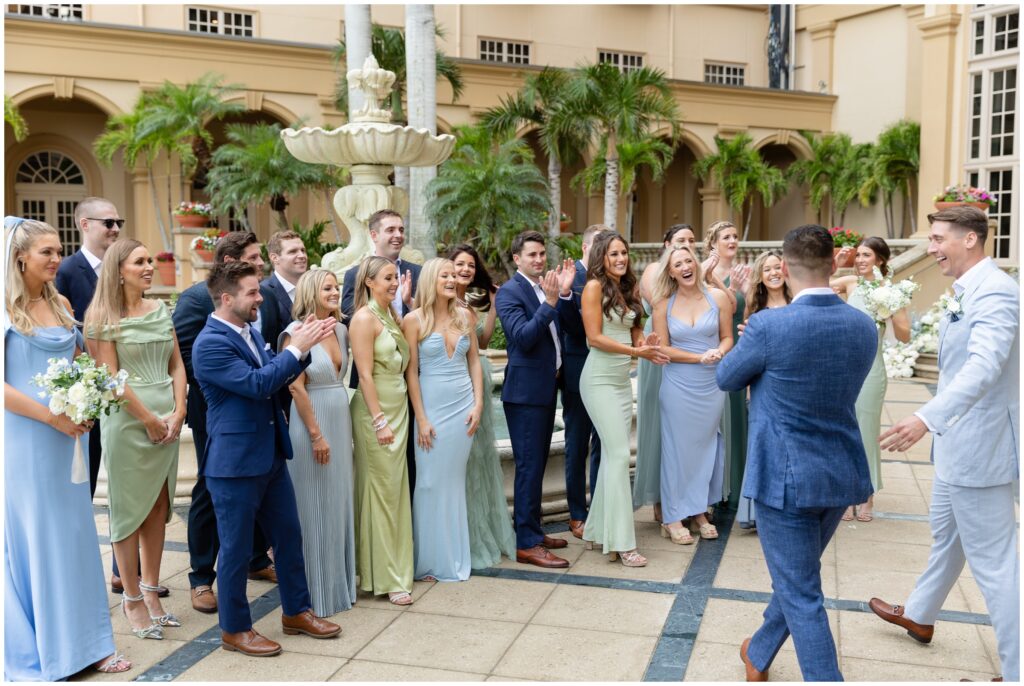 Wedding party celebrating first look at Ritz Carlton in Naples