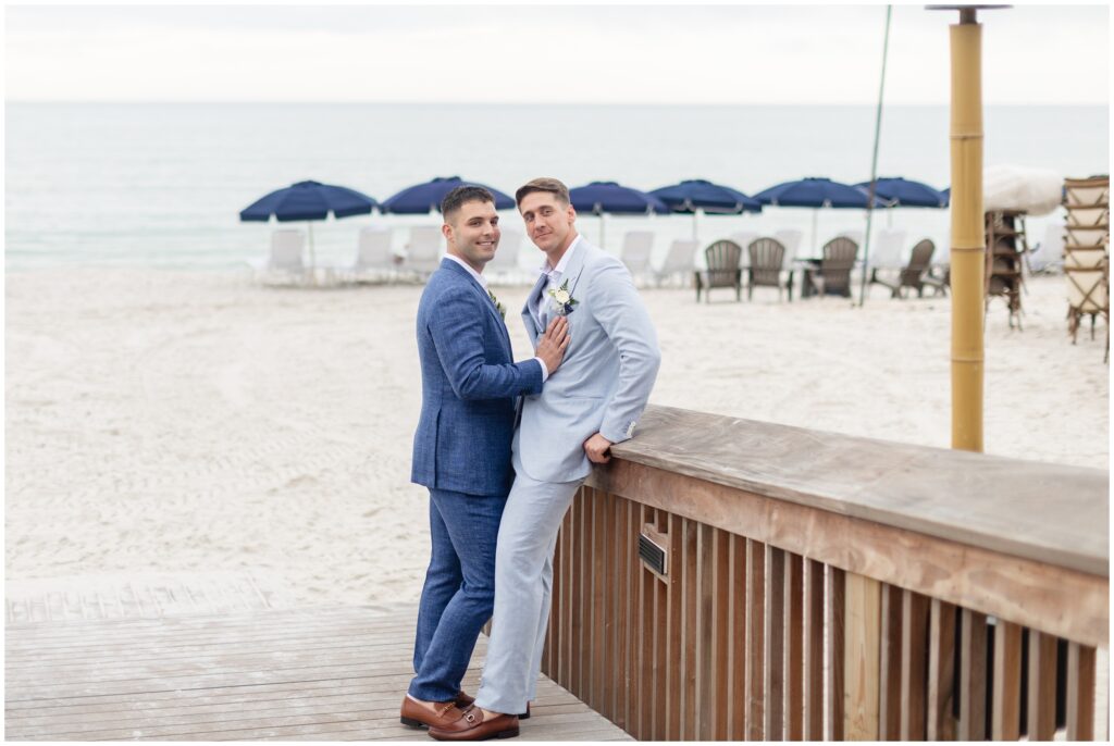 Grooms standing on ramp next to beach at Ritz Carlton in Naples