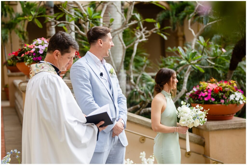 Groom watching groom walking down aisle at Ritz Carlton in Naples