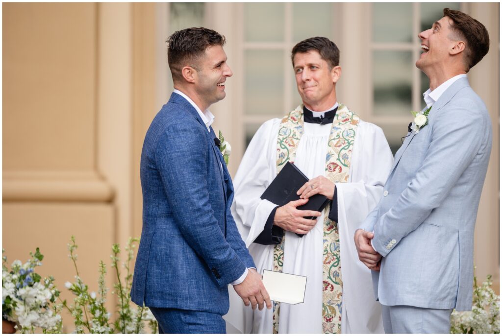 Grooms laughing during wedding ceremony