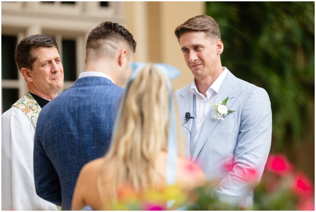 Grooms speaking to each other during wedding ceremony