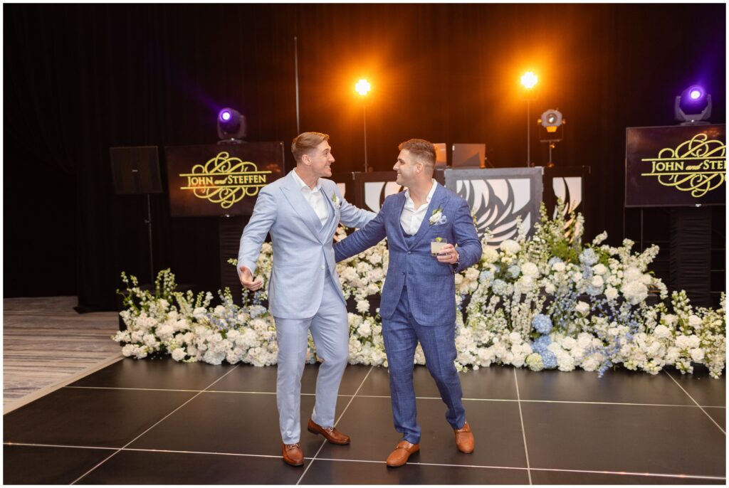 Grooms entering reception for grand entrance at Ritz Carlton in Naples