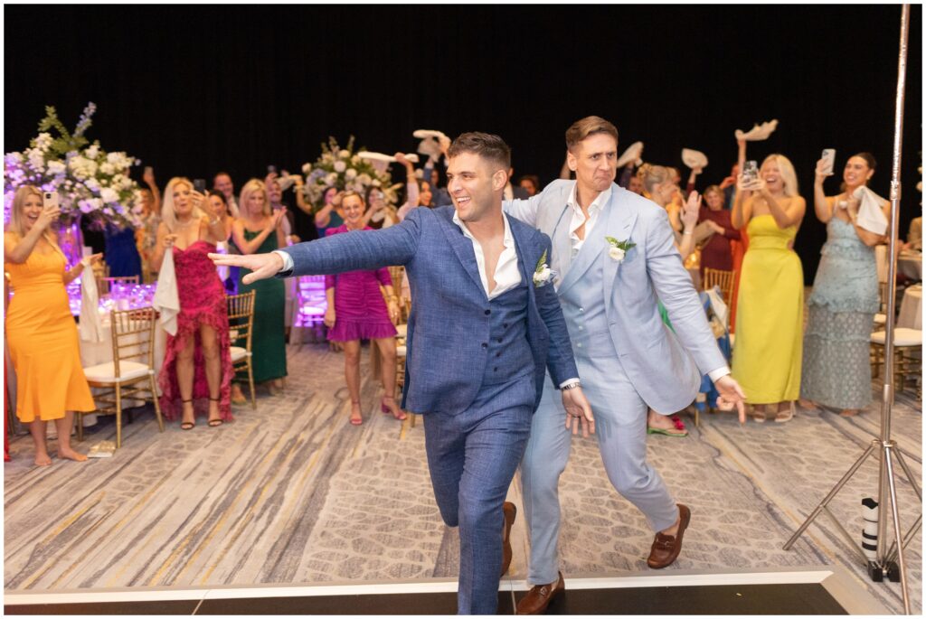 Guests celebrating grooms grand entrance at Ritz Carlton in Naples