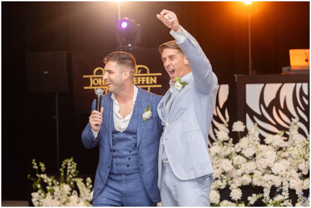 Grooms giving speeches during wedding reception