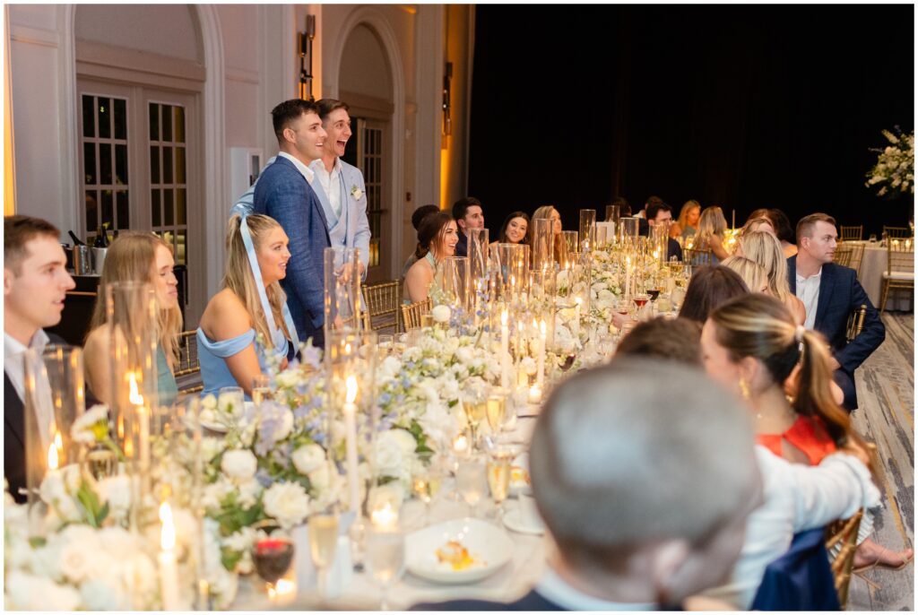 Guests and grooms listening to wedding toasts at Ritz Carlton in Naples