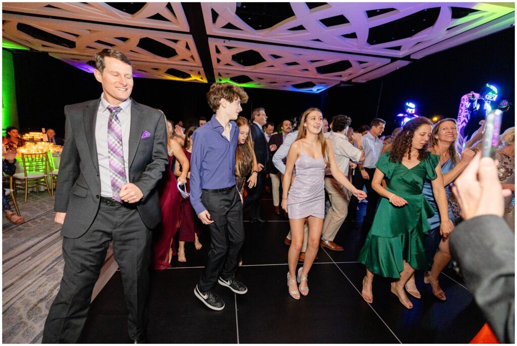 Wedding guests on dance floor  during wedding reception at Ritz Carlton in Naples