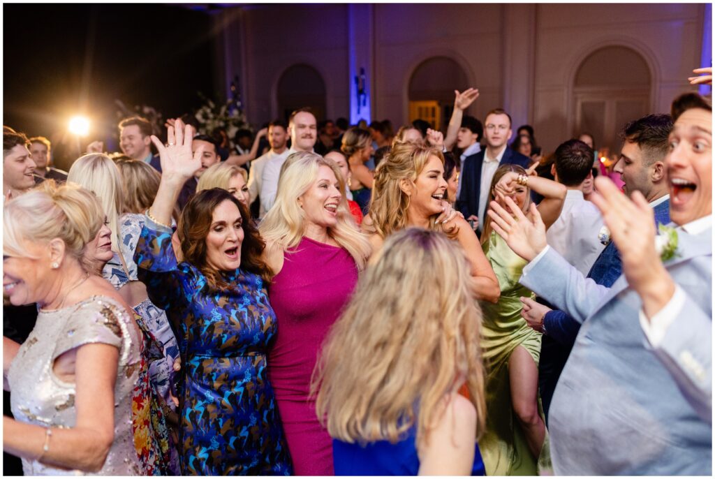 Wedding guests on dance floor  during wedding reception at Ritz Carlton in Naples