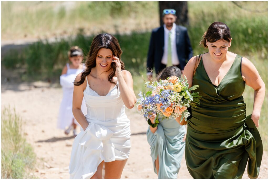 Bride walking outside at Boulder Creek by Wedgewood for first look