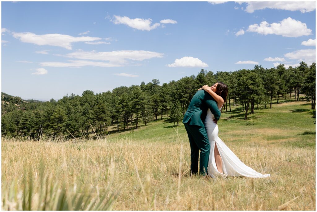 Bride and groom hugging during first look at Boulder Creek by Wedgewood