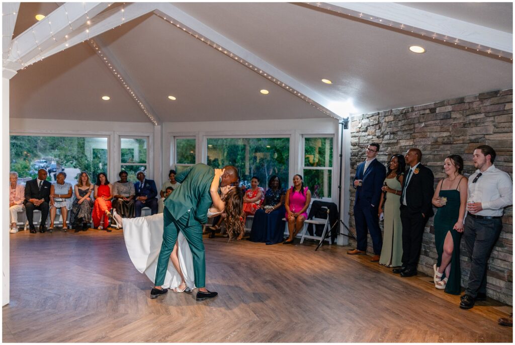 Groom dipping bride at the end of first dance