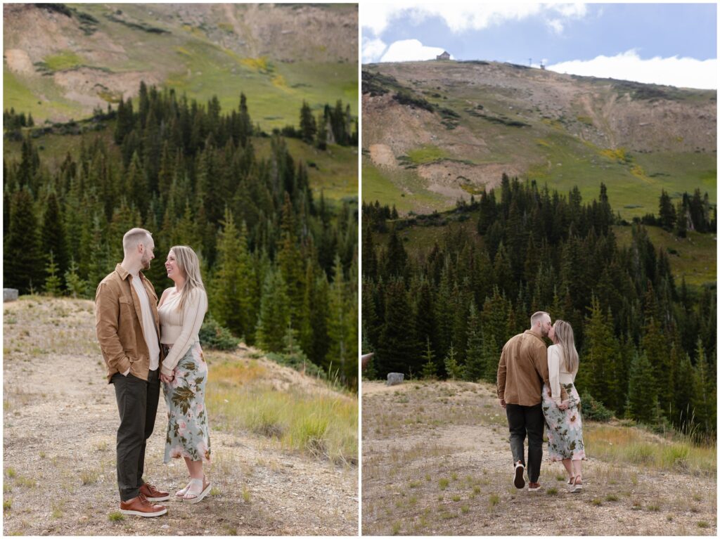 Couple walking down hill on trail in Breckenridge after proposal